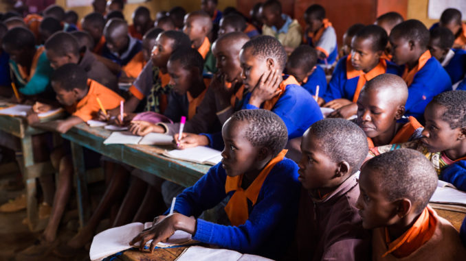 Children take notes during a Big Life conservation education presentation