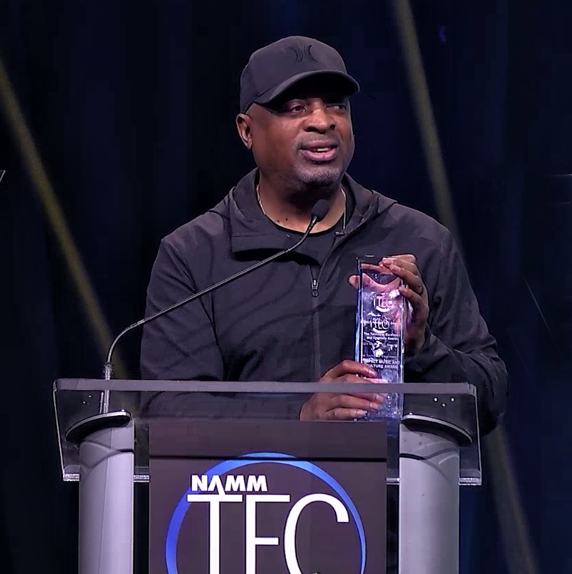 ChuckD of Public Enemy holding Impact Music and Culture Award NAMM  2023 