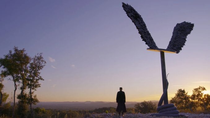ANSELM Still1 still from documentary Anselm. With artist and art fra,ed by sunset.